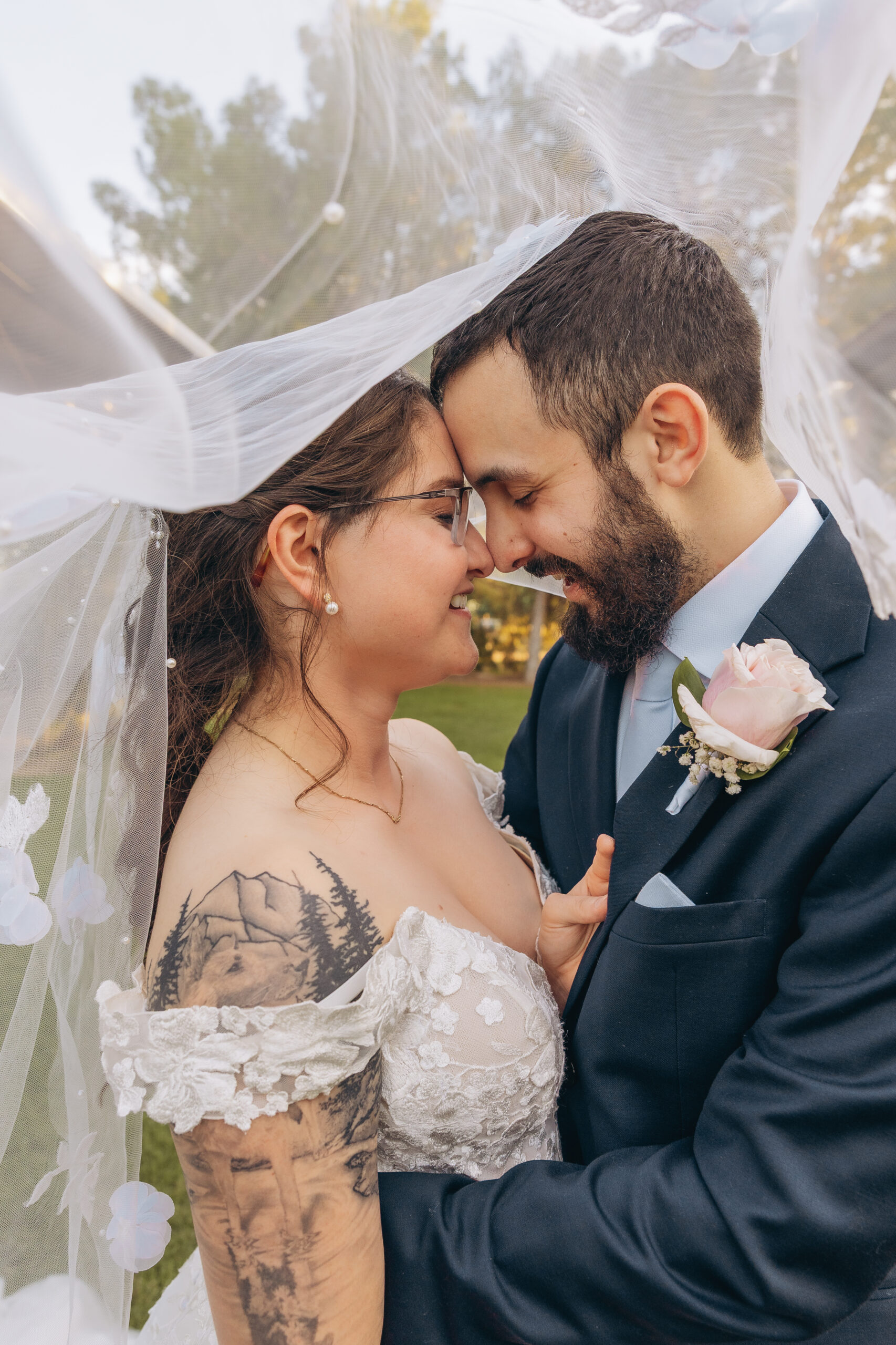 Intimate portrait of bride and groom under the veil during their Schnepf Farms wedding in Queen Creek, Arizona