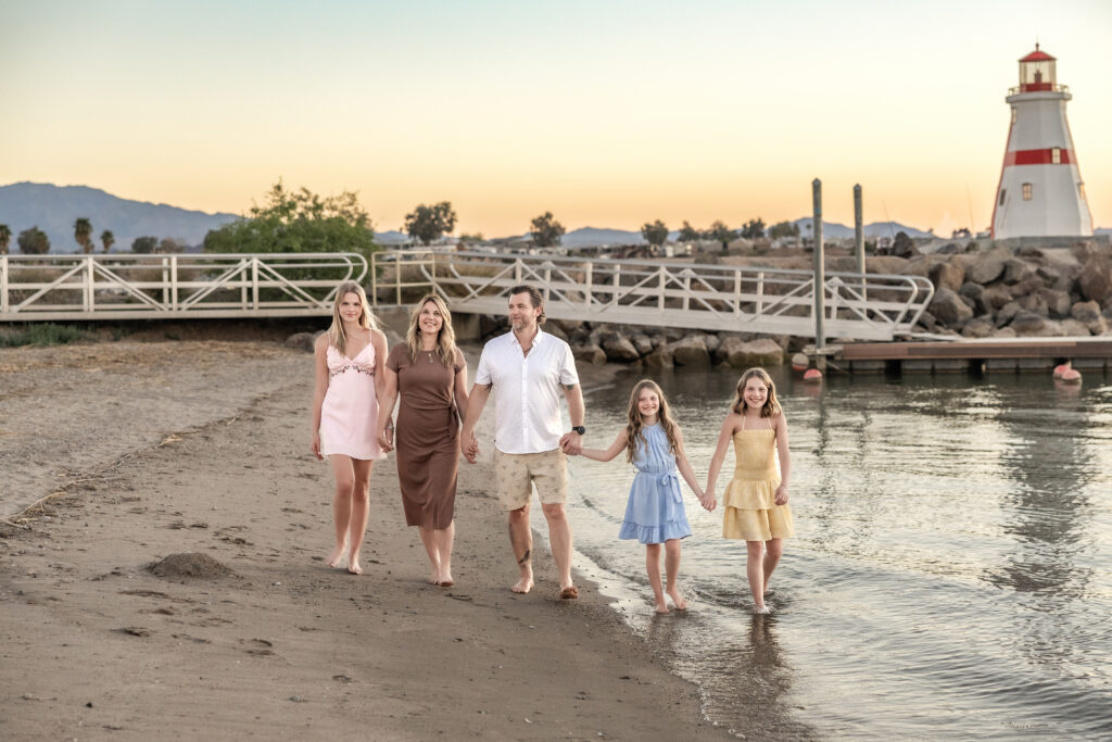 Lake Havasu family photographer — family walking along Windsor Beach shoreline at sunset