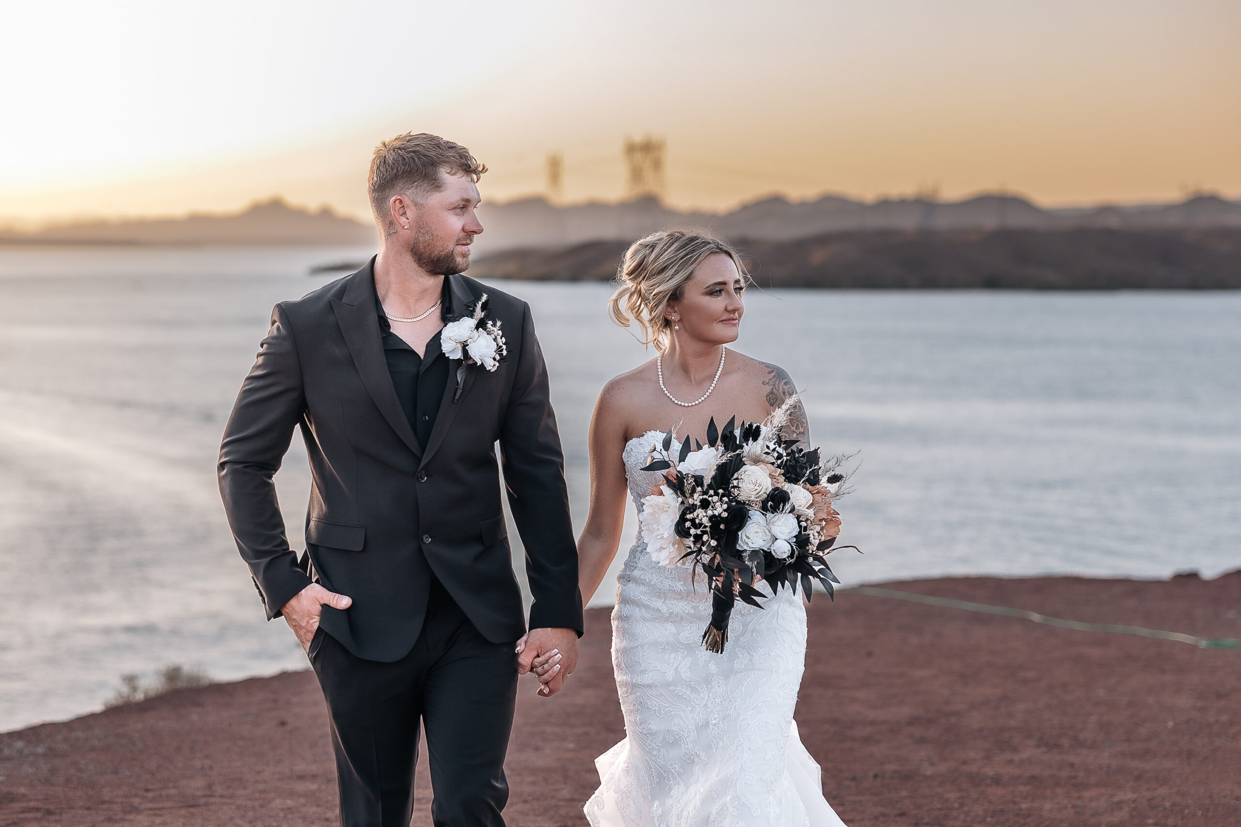 Madison and Caleb at sunset during their Havasu Springs wedding overlooking Lake Havasu