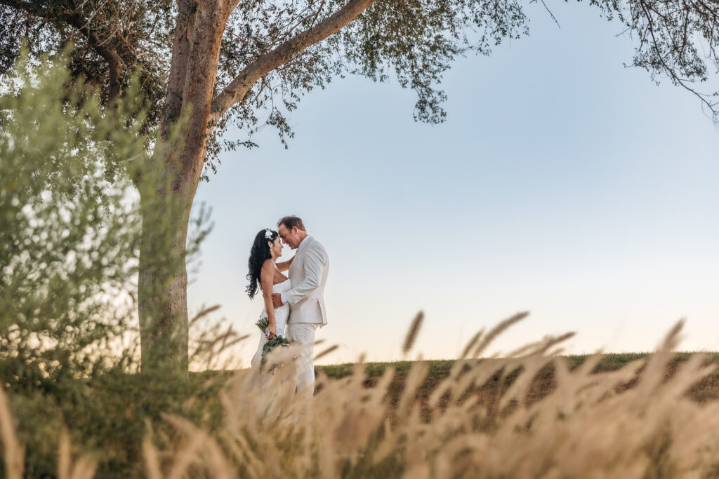 Paul and Lizzy sharing an intimate moment during their newlywed wedding portraits
