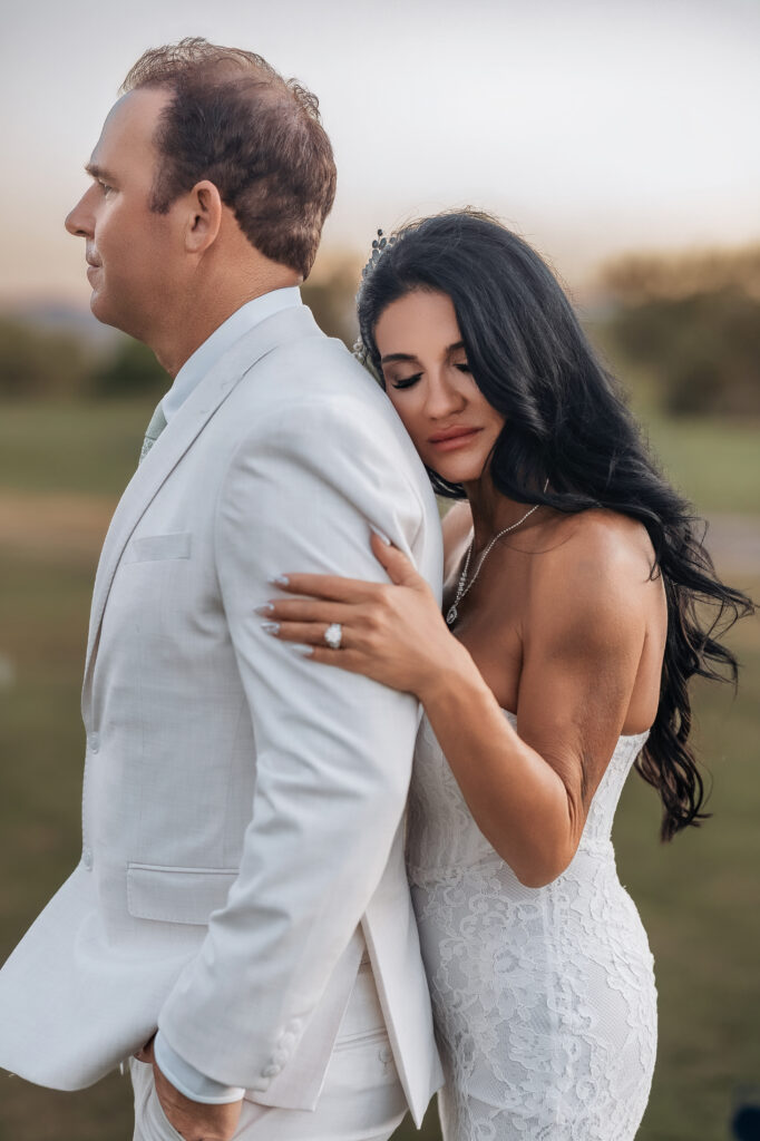 Paul dipping Lizzy beneath a tree during their newlywed portraits in Lake Havasu